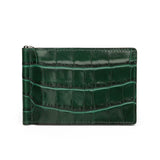 Green crocodile-patterned money clip wallet on a white background