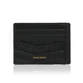 Front view of black embossed crocodile pattern leather card holder with 4 card slots