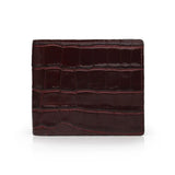 Brown crocodile-patterned wallet on a white background