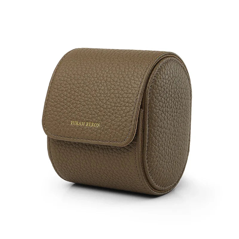 Etoupe pebble leather watch storage box with 'Hiram Beran' branding on a white background