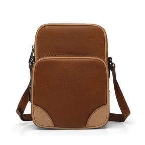 Brown leather reporter bag on a white background