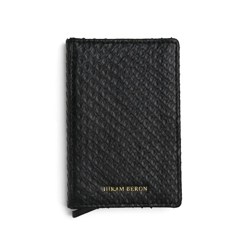 Black python skin pop up card holder with 'Hiram Beron' branding on a white background