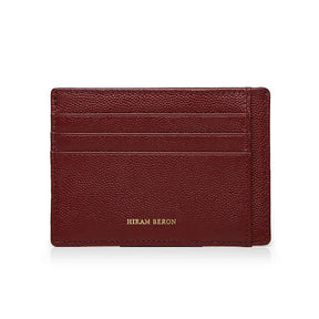 Burgundy leather cardholder with 'Hiram Beron' branding on a white background