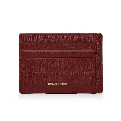 Burgundy leather cardholder with 'Hiram Beron' branding on a white background