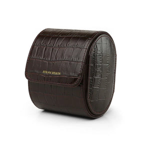 Brown aligator pattern leather watch roll with 'Hiram Beran' branding on a white background