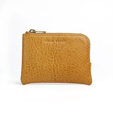 yellow leather coin pouch with 'Hiram Beron' branding on a white background