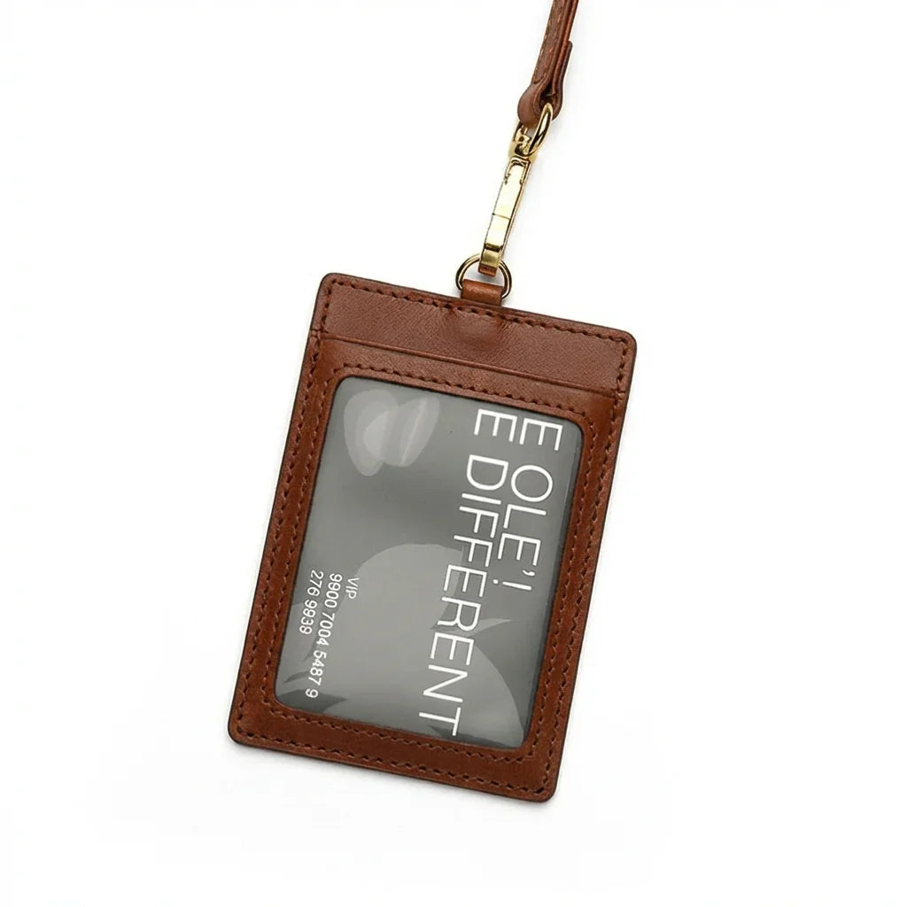 Brown leather ID holder with a clear card window on a white background