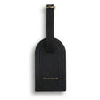 Black leather luggage tag with 'Hiram Beron' branding on a white background