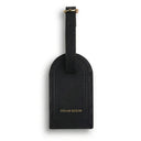 Black leather luggage tag with 'Hiram Beron' branding on a white background