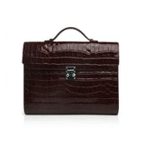 Burgundy crocodile-patterned leather business folios on a white background