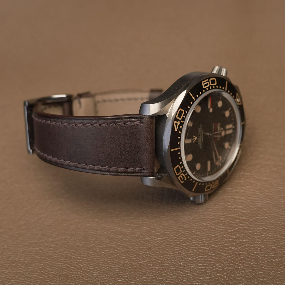 Side profile of 1.8mm slim flat Badalassi Minerva Liscio leather watch strap fitted on sports watch case