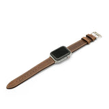 Smartwatch with a brown leather strap on a white background