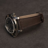 Side profile of 1.8mm slim flat Haas Barenia leather watch band fitted on sports watch case   