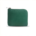 Green vegetable tanned leather coin wallet with a zipper on a white background