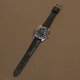 Hand saddle-stitched black HCP alligator leather watch band fitted on luxury fluted bezel watch