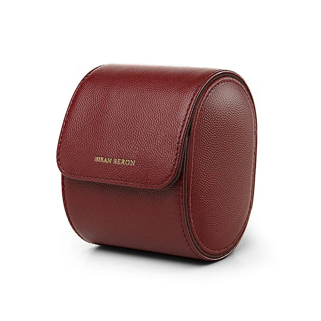 Red leather watch storage cases with 'Hiram Beran' branding on a white background