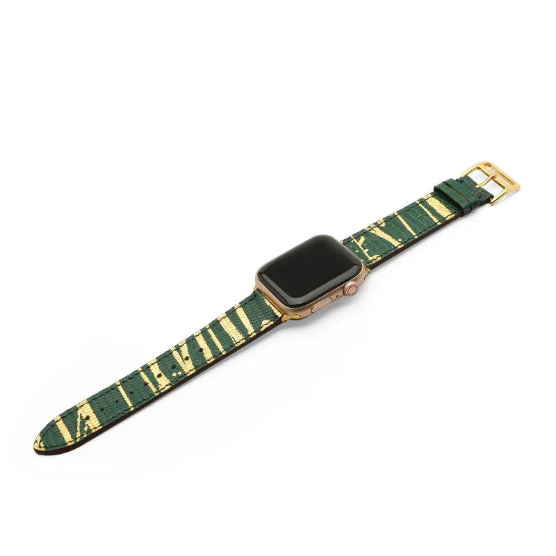 Smartwatch with a green and gold lizard skin watch band on a white background