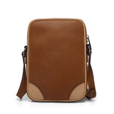the back of the brown -Leather Reporter Bag