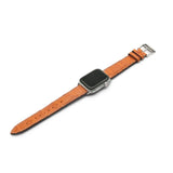 Smartwatch with a orange leather strap on a white background