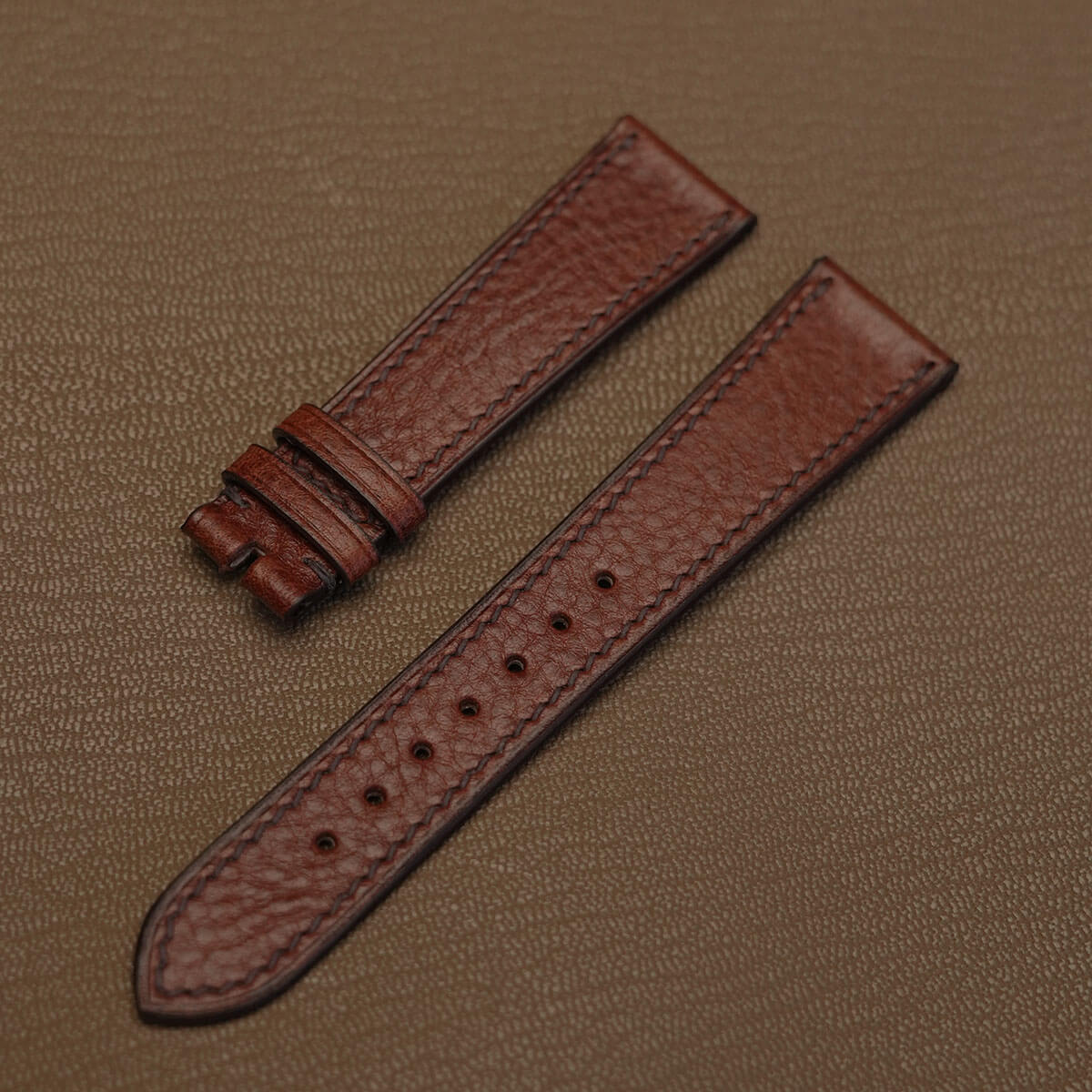 Pair of 1.8mm flat brown Italian Ausonia double shoulder leather watch bands showing natural textured grain  