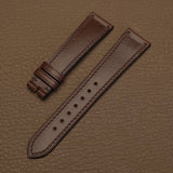 Pair of 1.8mm flat brown Horween Chromexcel leather watch bands showing natural pull-up finish   
JPG