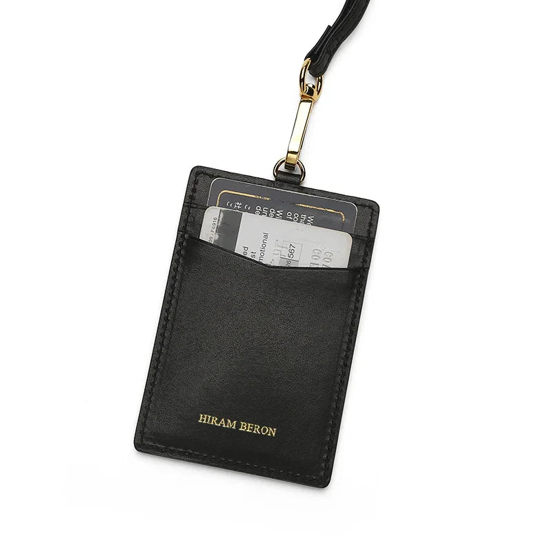 Black leather cardholder with a lanyard on a white background