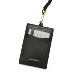 Black leather cardholder with a lanyard on a white background