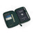Green epsom leather passport wallet with a passport, card slots, and a pen on a white background