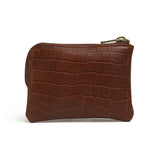 Brown leather coin pouch with crocodile texture on a white background