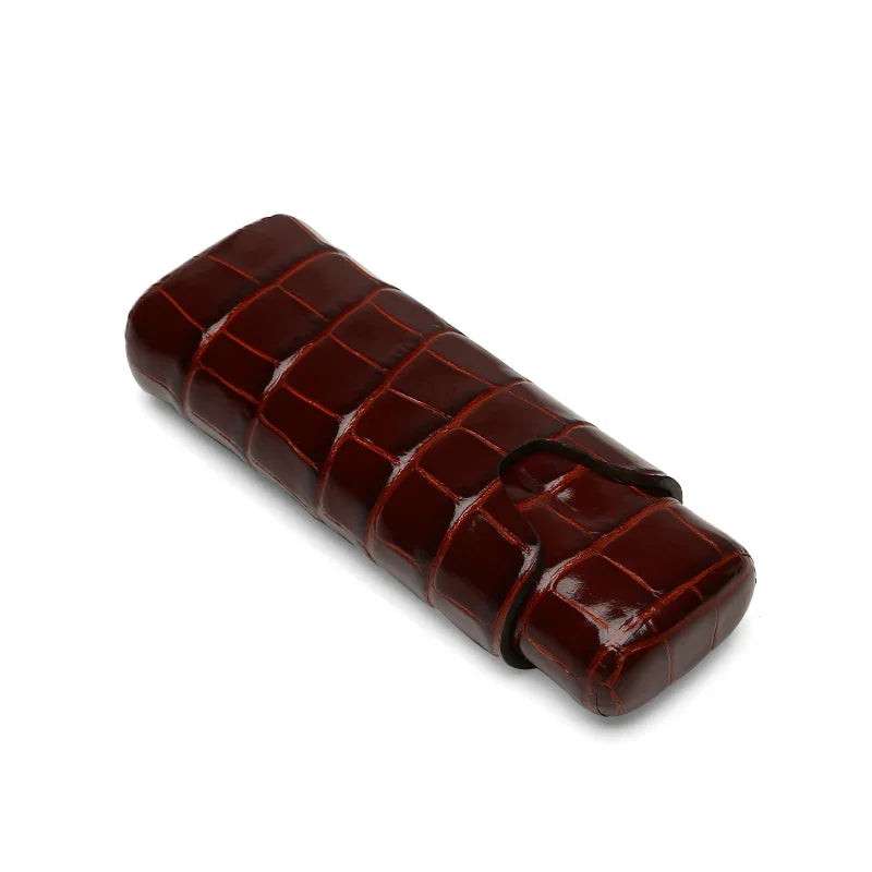 Luxury crocodile-embossed leather cigar case with secure strap closure