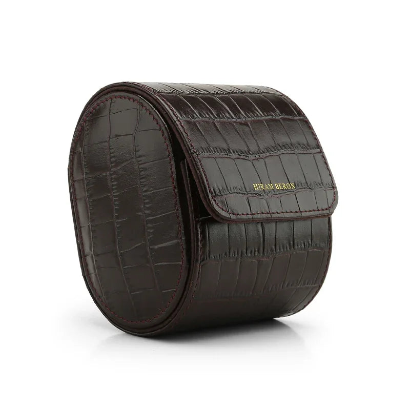 Brown crocodile-patterned leather watch box on a white background