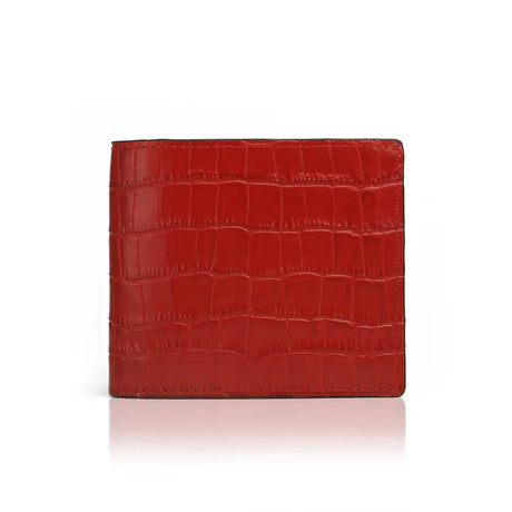 Red aligator-patterned wallet on a white background