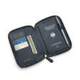 Navy blue leather passport wallet with a German passport, cards, and a pen on a white background