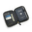 Black passport wallet with a German passport, cards, and a pen on a white background