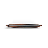 Thin brown leather card holder on a white background
