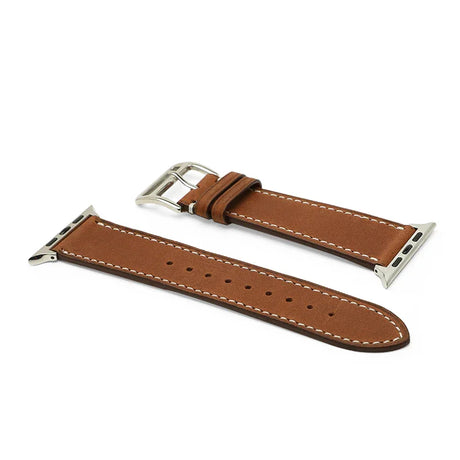 Brown leather watch strap with silver metal clasp on a white background