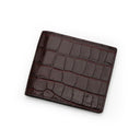 Burgundy bifold wallet with crocodile pattern on a white background