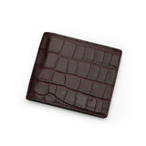 Burgundy bifold wallet with crocodile pattern on a white background