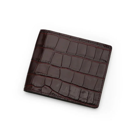 Burgundy bifold wallet with crocodile pattern on a white background