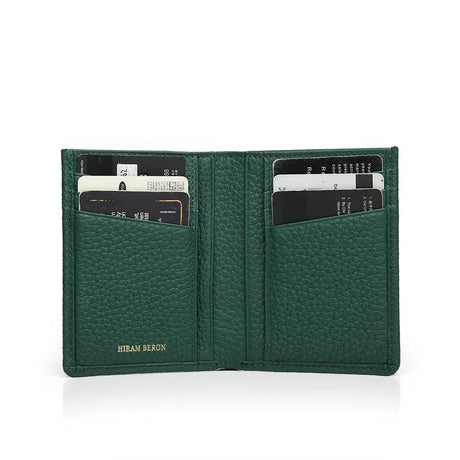 Green pebble leather wallet with card slots on a white background