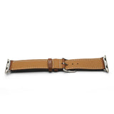 Brown leather watch strap with silver metal clasp on a white background