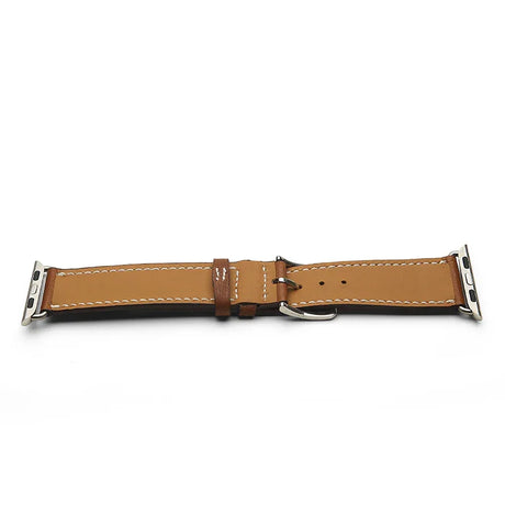 Brown leather watch strap with silver metal clasp on a white background