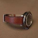 Side profile of 1.8mm slim flat brown Ausonia leather watch strap fitted on sports watch case 