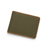 Green canvas wallet with brown leather border on a white background