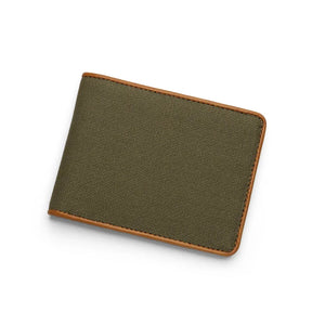 Green canvas wallet with brown leather border on a white background