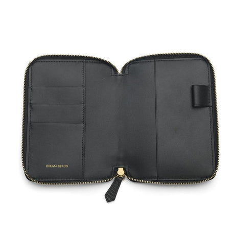 Black leather passport wallet with zipper on a white background