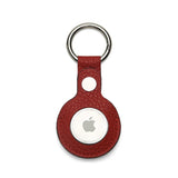 Red pebble leather airtage keychain on a white background