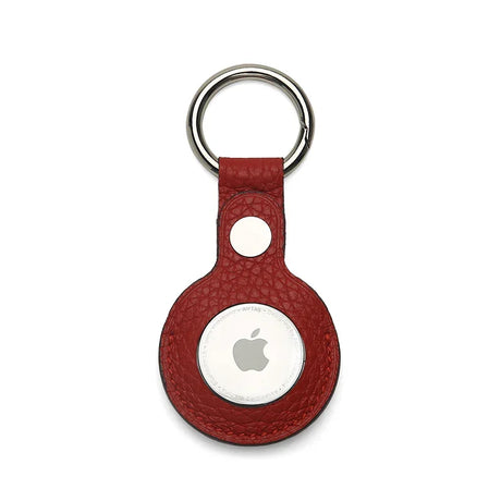 Red pebble leather airtage keychain on a white background