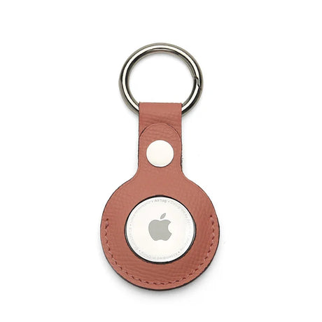 Pink epsom leather airtag keychain on a white background