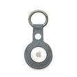 Apple AirTag holder in a gray leather case on a white background